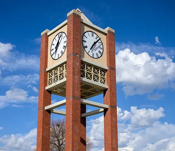 Clock tower with clouds behind